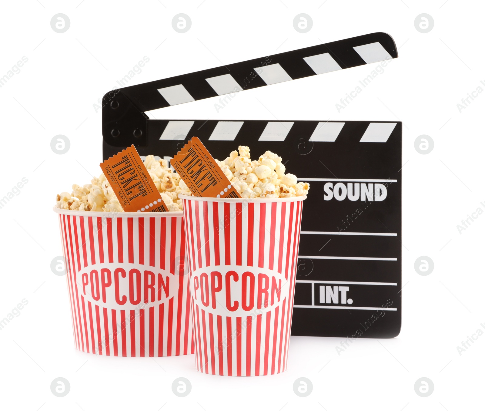 Photo of Tasty popcorn, clapper and movie tickets isolated on white