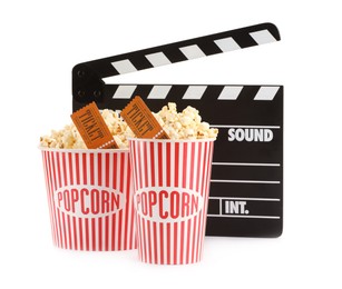 Photo of Tasty popcorn, clapper and movie tickets isolated on white