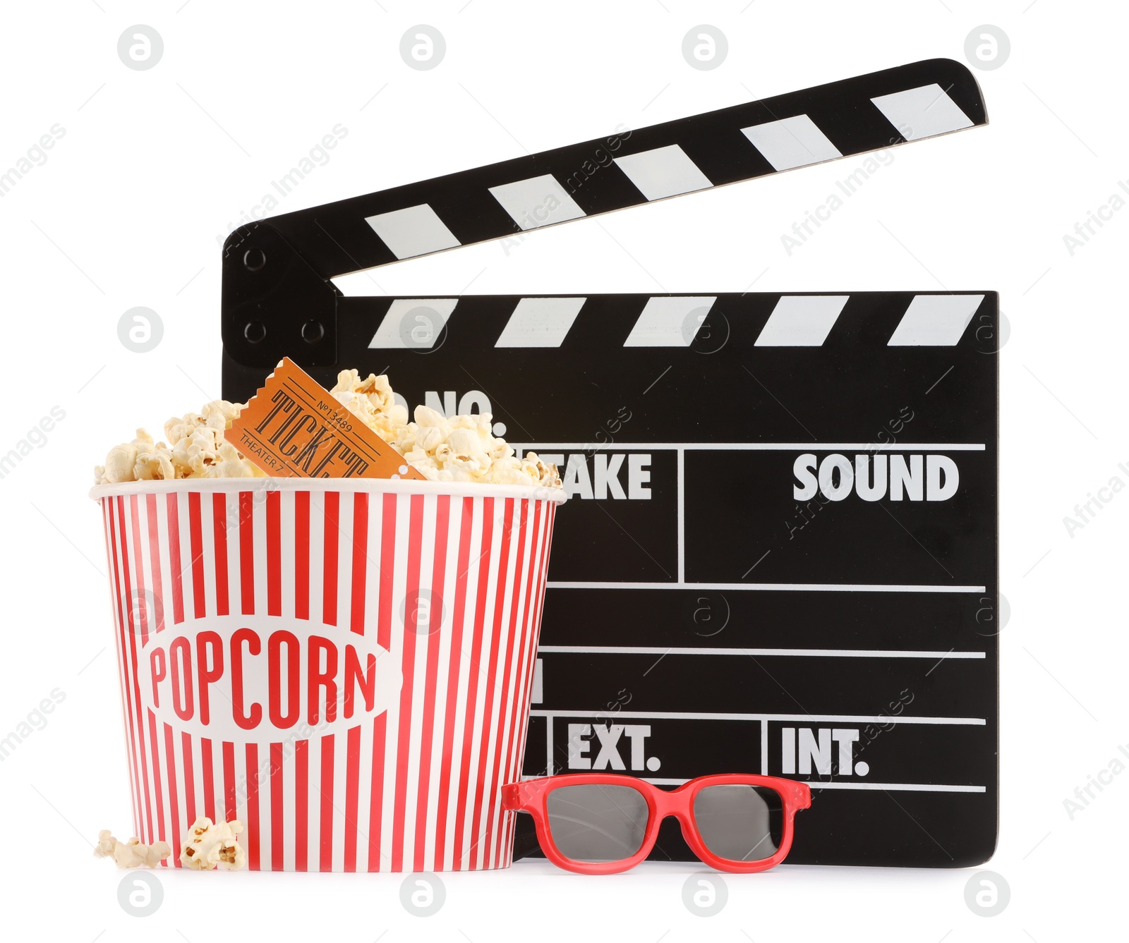 Photo of Tasty popcorn, clapper, glasses and movie ticket isolated on white