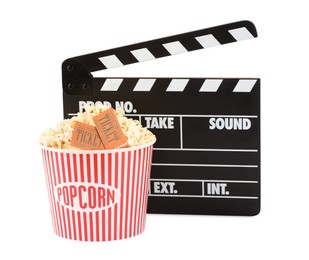 Photo of Tasty popcorn, clapper and movie tickets isolated on white