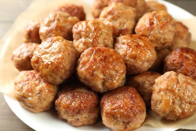 Photo of Many delicious meatballs on table, closeup view