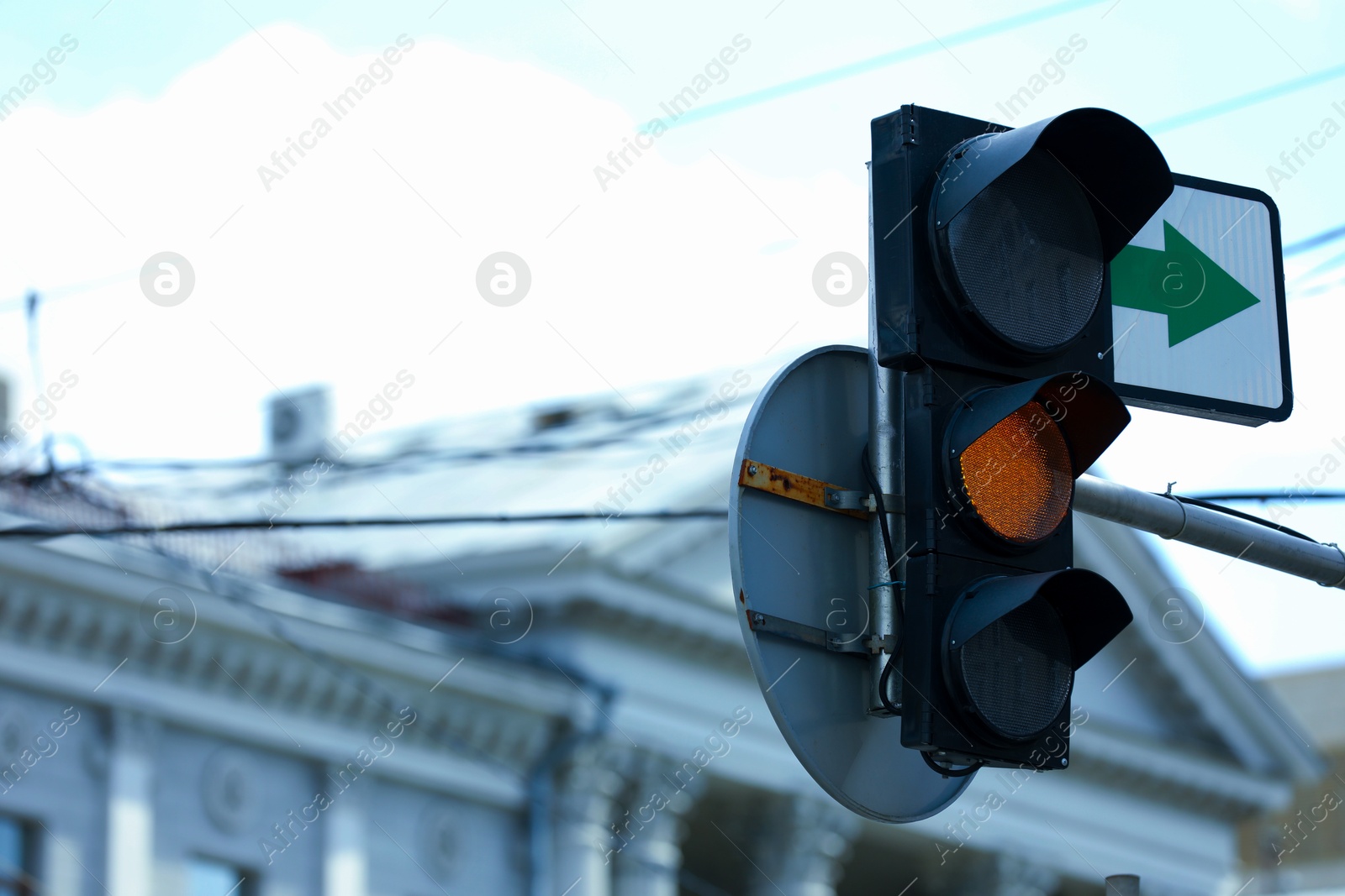 Photo of View of traffic light in city on sunny day. Space for text