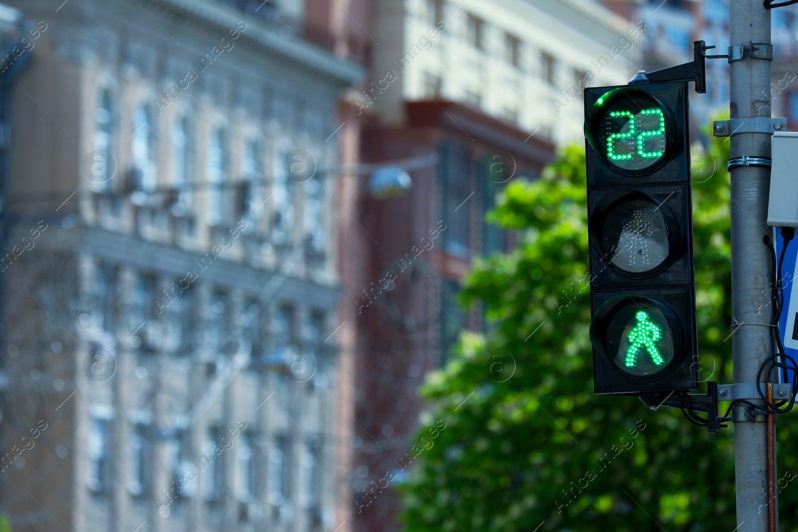 Photo of View of traffic light in city on sunny day. Space for text