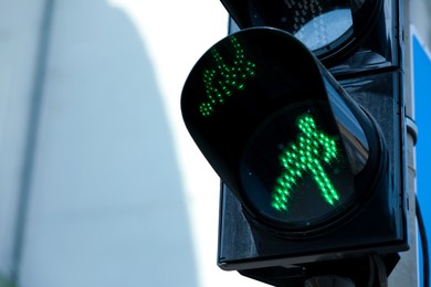 Photo of Closeup view of traffic light in city on sunny day. Space for text