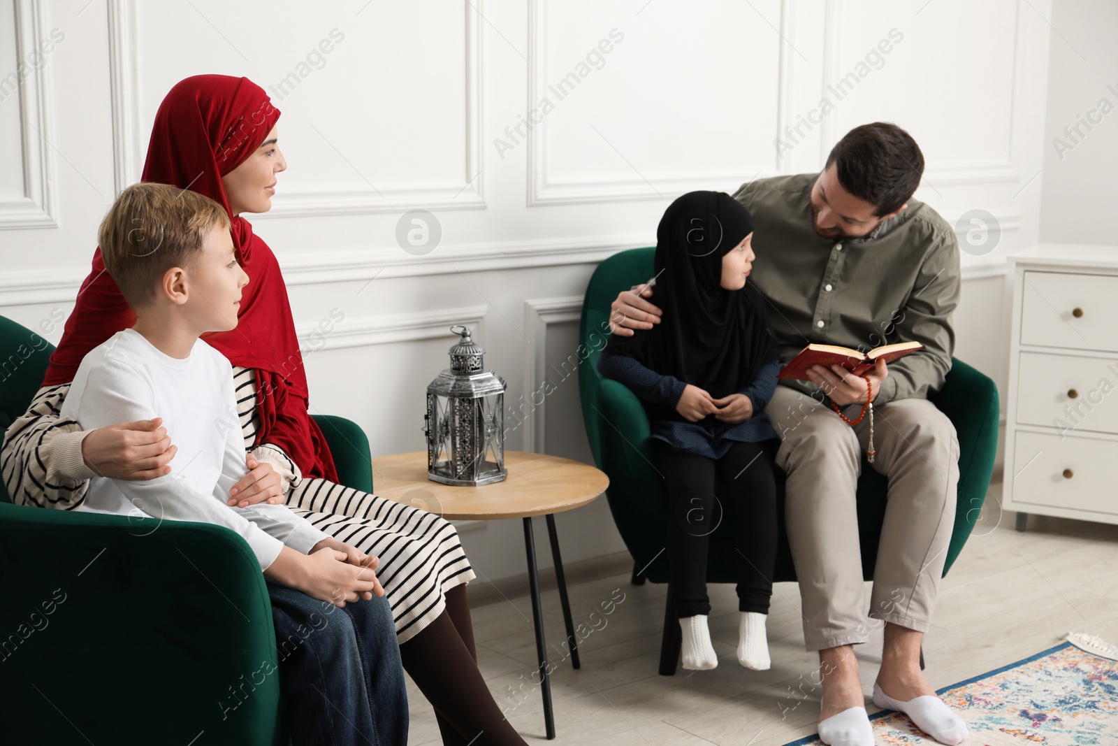 Photo of Happy Muslim family spending time together at home