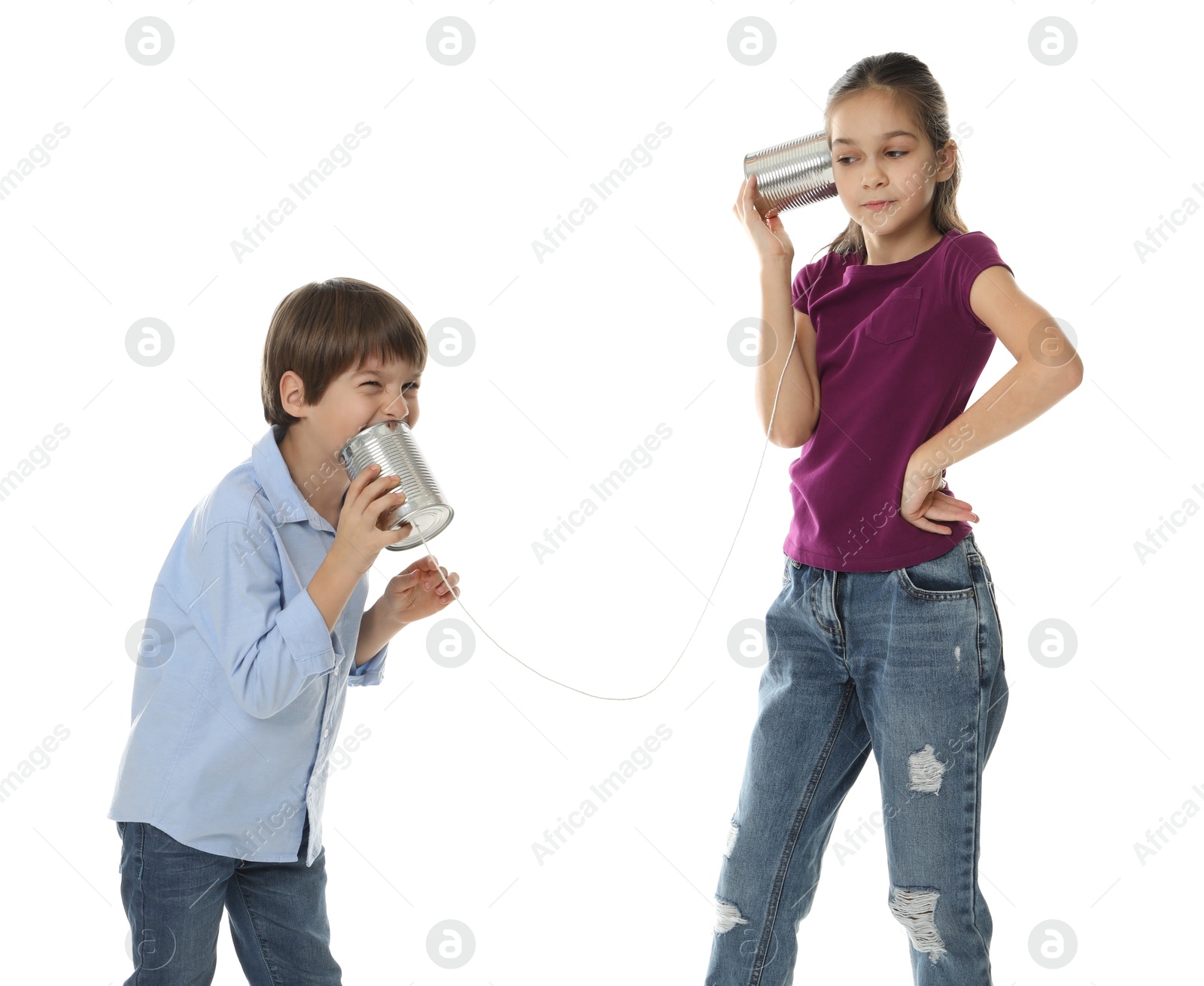 Photo of Girl and boy talking on tin can telephone against white background