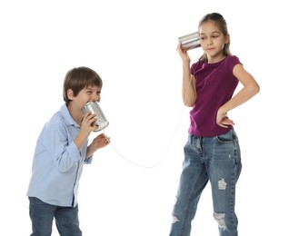 Photo of Girl and boy talking on tin can telephone against white background