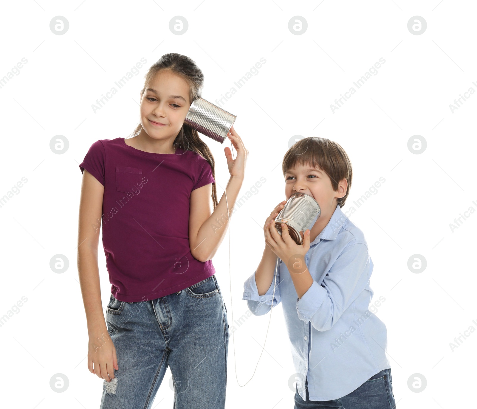 Photo of Girl and boy talking on tin can telephone against white background