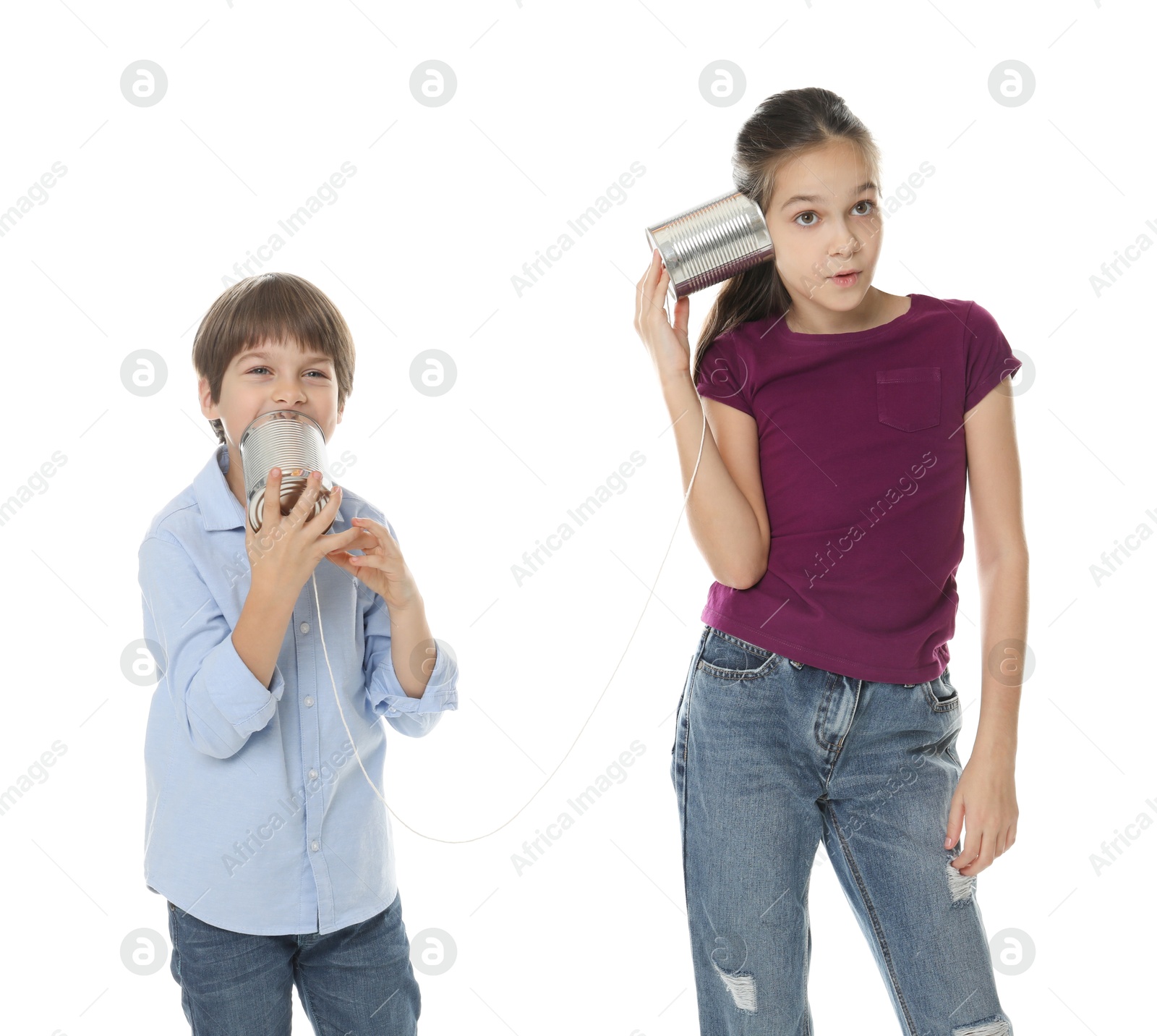 Photo of Girl and boy talking on tin can telephone against white background