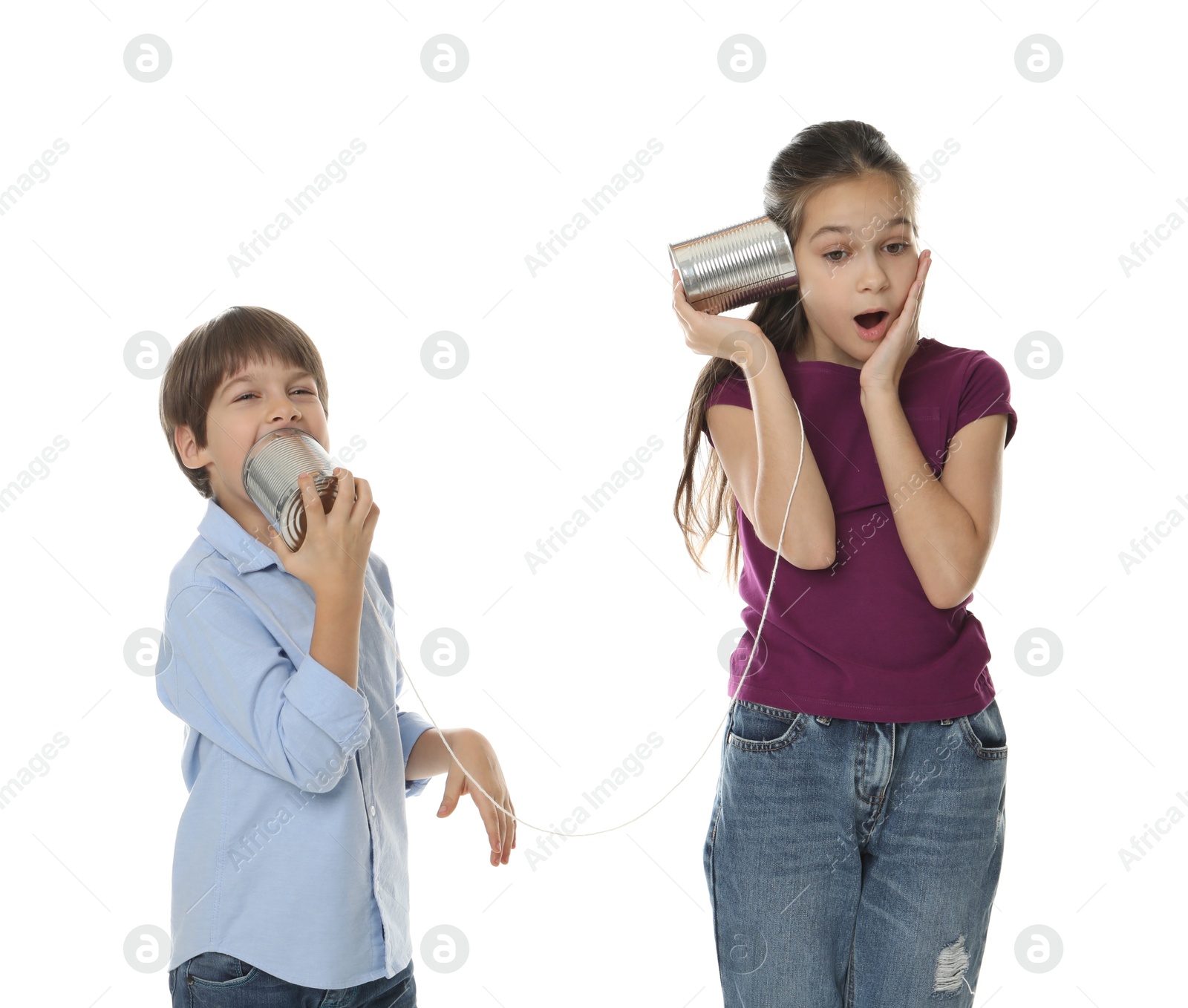 Photo of Girl and boy talking on tin can telephone against white background