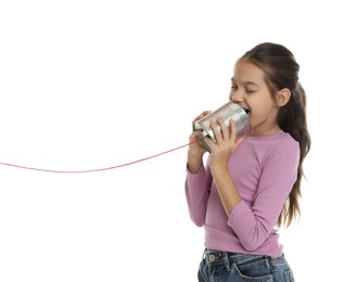 Photo of Girl using tin can telephone on white background