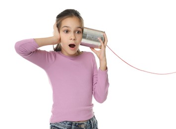 Photo of Girl using tin can telephone on white background