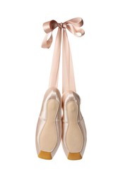 Photo of Pair of beautiful pointe shoes in air isolated on white