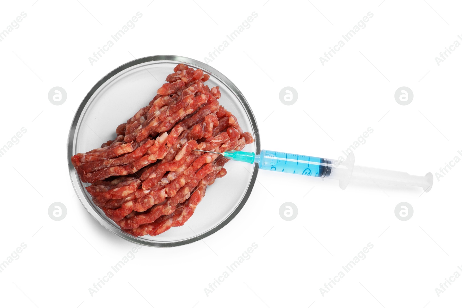 Photo of GMO concept. Minced meat and syringe isolated on white, top view