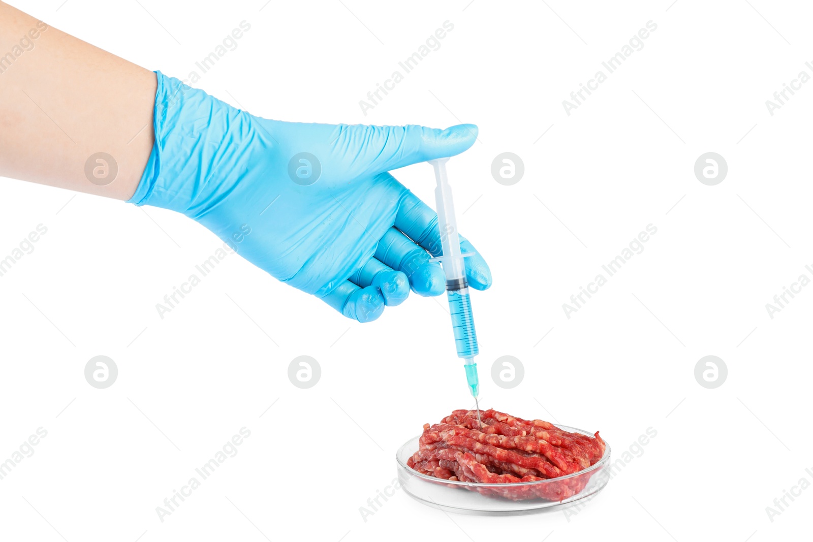 Photo of GMO concept. Scientist injecting something into minced meat on white background, closeup