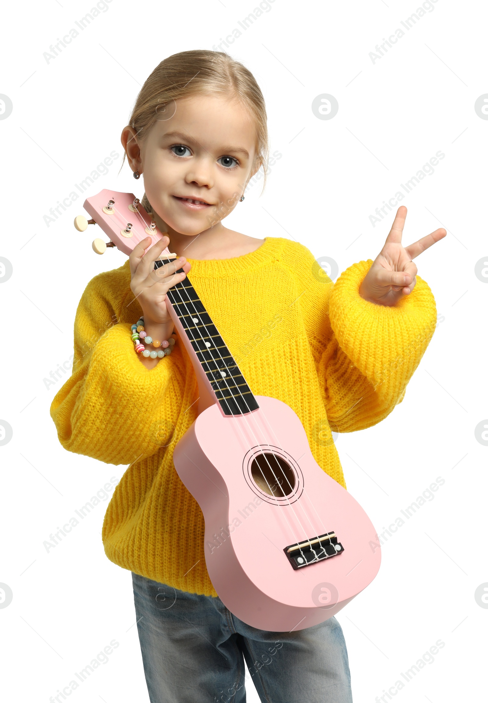 Photo of Little girl with ukulele showing V-sign on white background