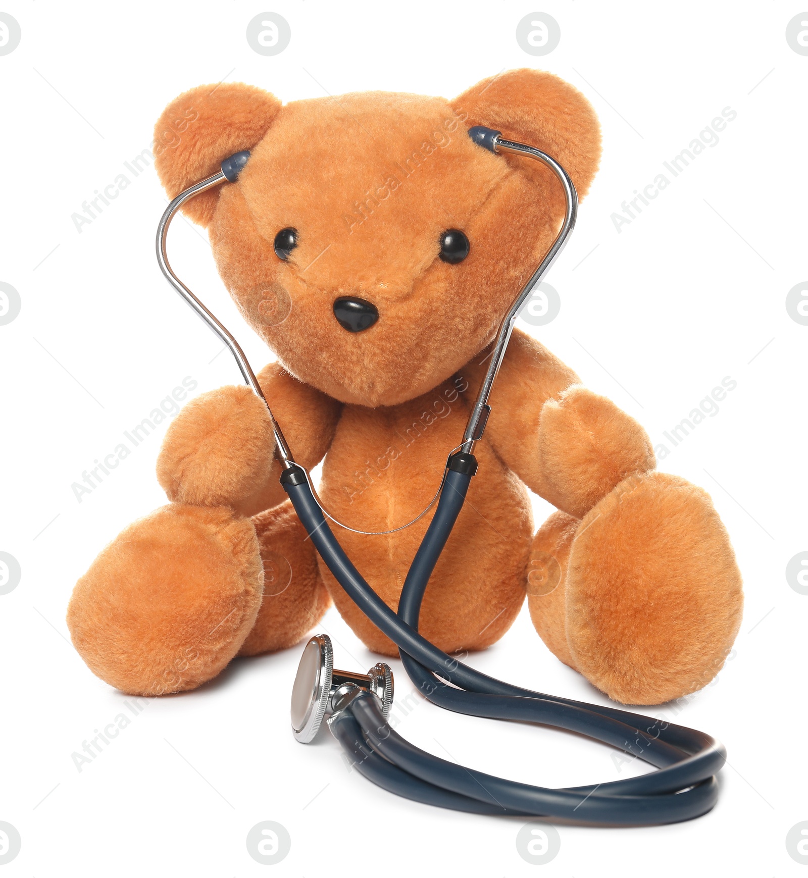 Photo of Pediatrics concept. Teddy bear and stethoscope isolated on white