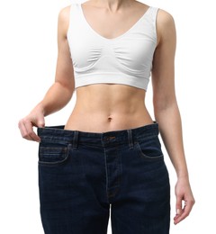 Photo of Weight loss. Woman wearing big jeans on white background, closeup