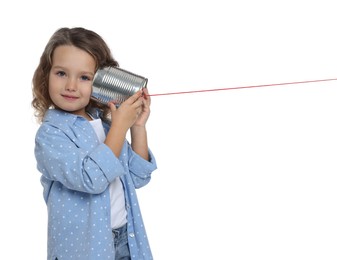 Photo of Girl using tin can telephone on white background