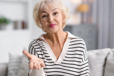 Photo of Portrait of grandmother with beautiful makeup at home