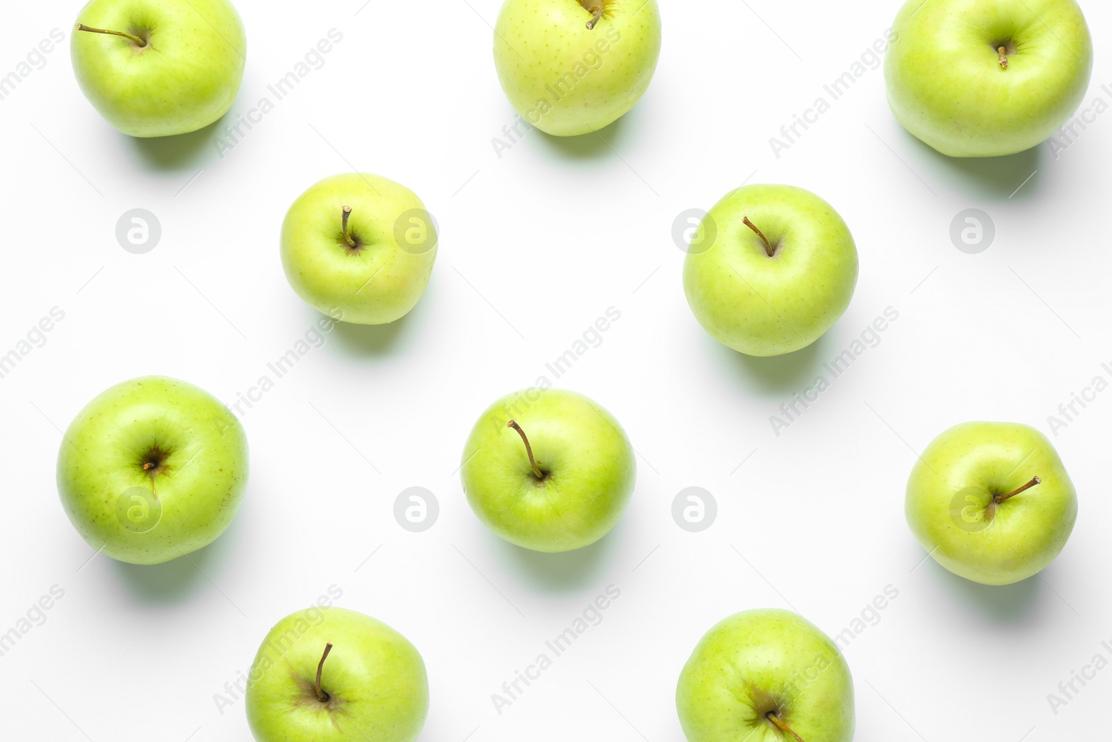 Photo of Green apples on white background, flat lay