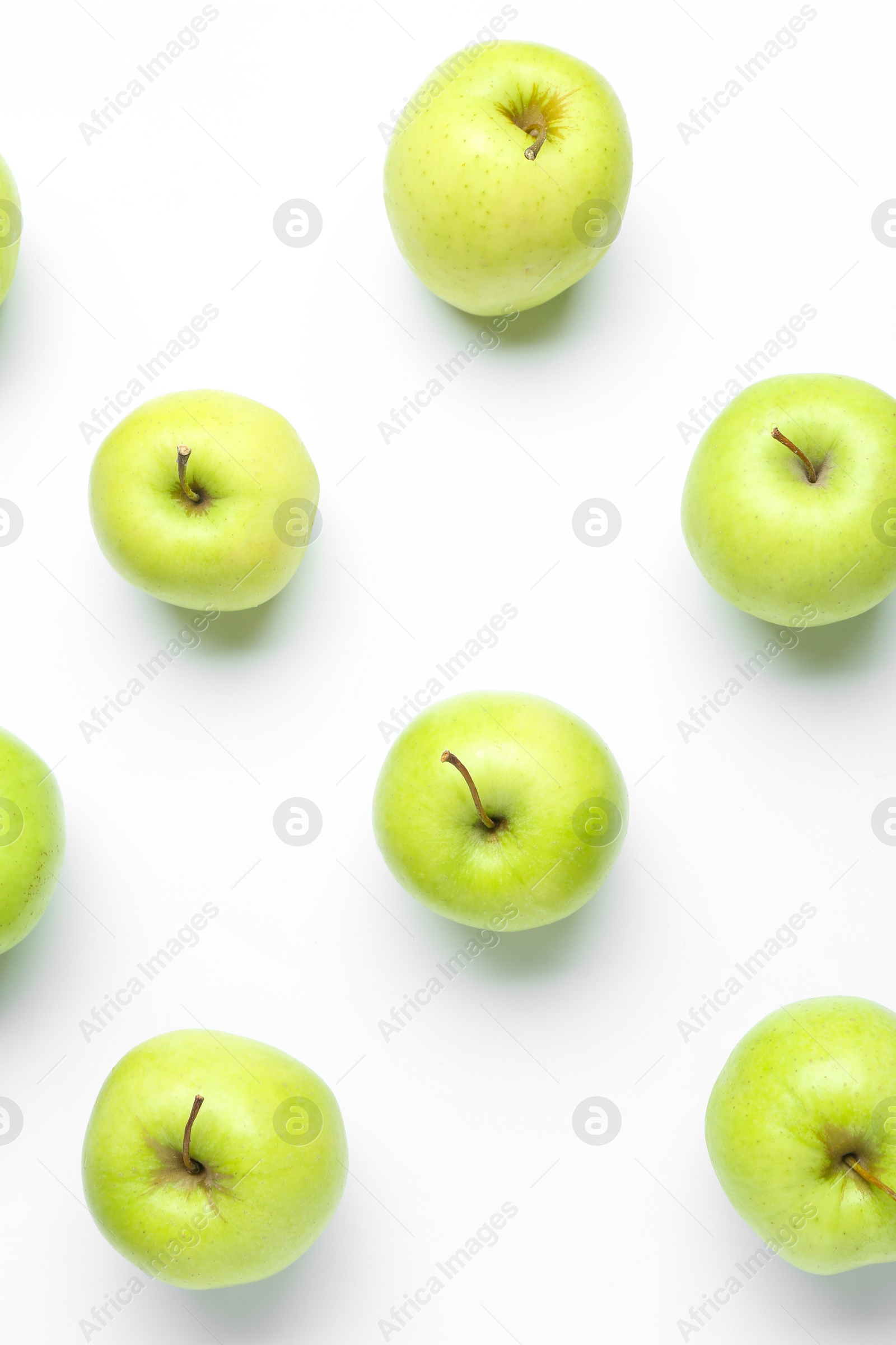 Photo of Green apples on white background, flat lay