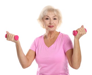 Photo of Senior woman exercising with dumbbells on white background