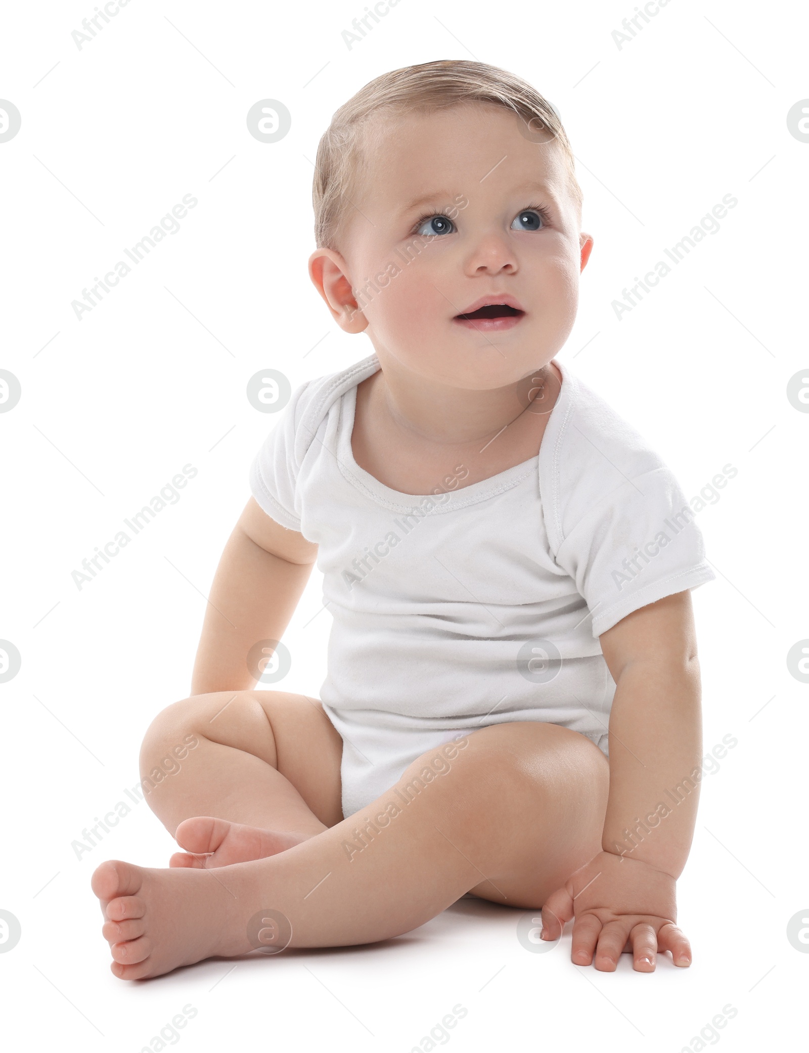 Photo of Cute little baby sitting on white background