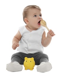 Photo of Little baby with piggybank and toy on white background