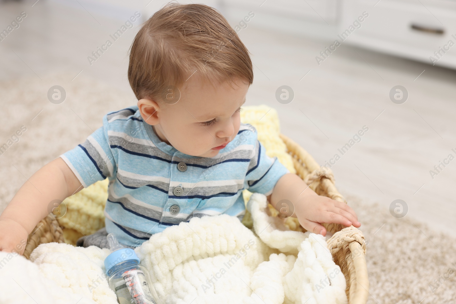 Photo of Little baby with money in bottle at home