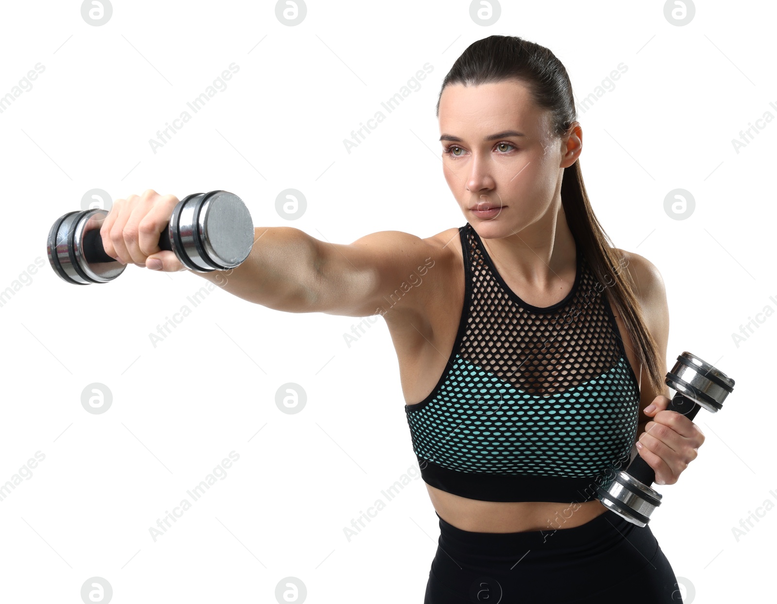 Photo of Beautiful woman in sportswear training with dumbbells on white background