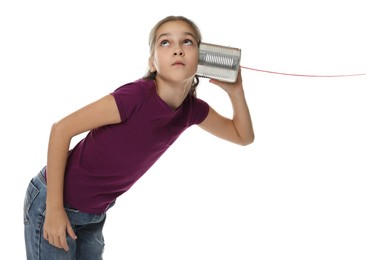 Photo of Girl using tin can telephone on white background