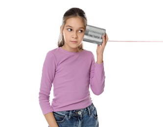 Photo of Girl using tin can telephone on white background