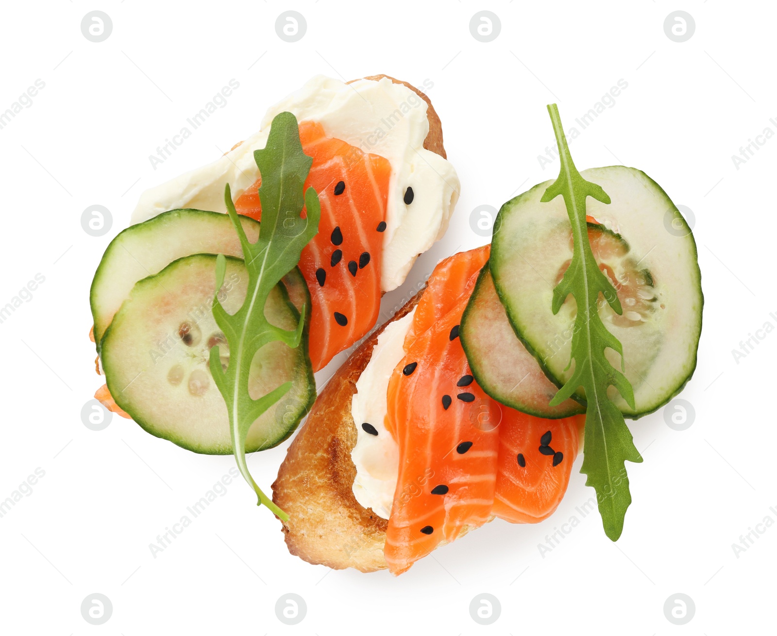 Photo of Delicious bruschette with cream cheese, salmon and cucumber isolated on white, top view