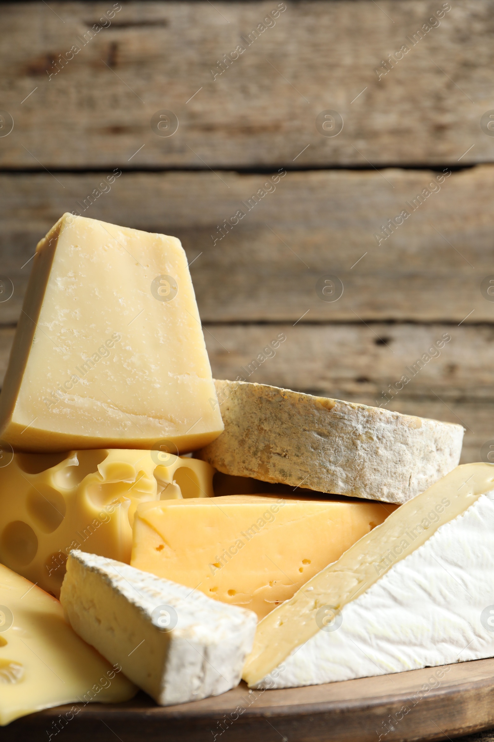 Photo of Different types of cheese on table, closeup