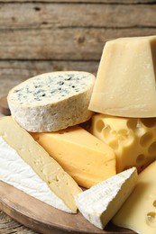 Photo of Different types of cheese on table, closeup