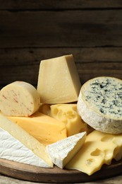 Photo of Different types of cheese on table, closeup