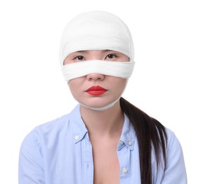 Photo of Woman with nose wrapped in medical bandage after plastic surgery operation on white background