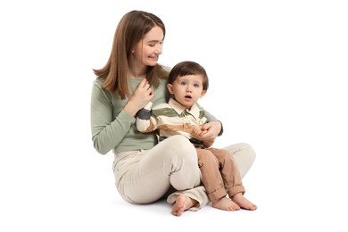 Photo of Happy mother with her cute little son on white background, space for text