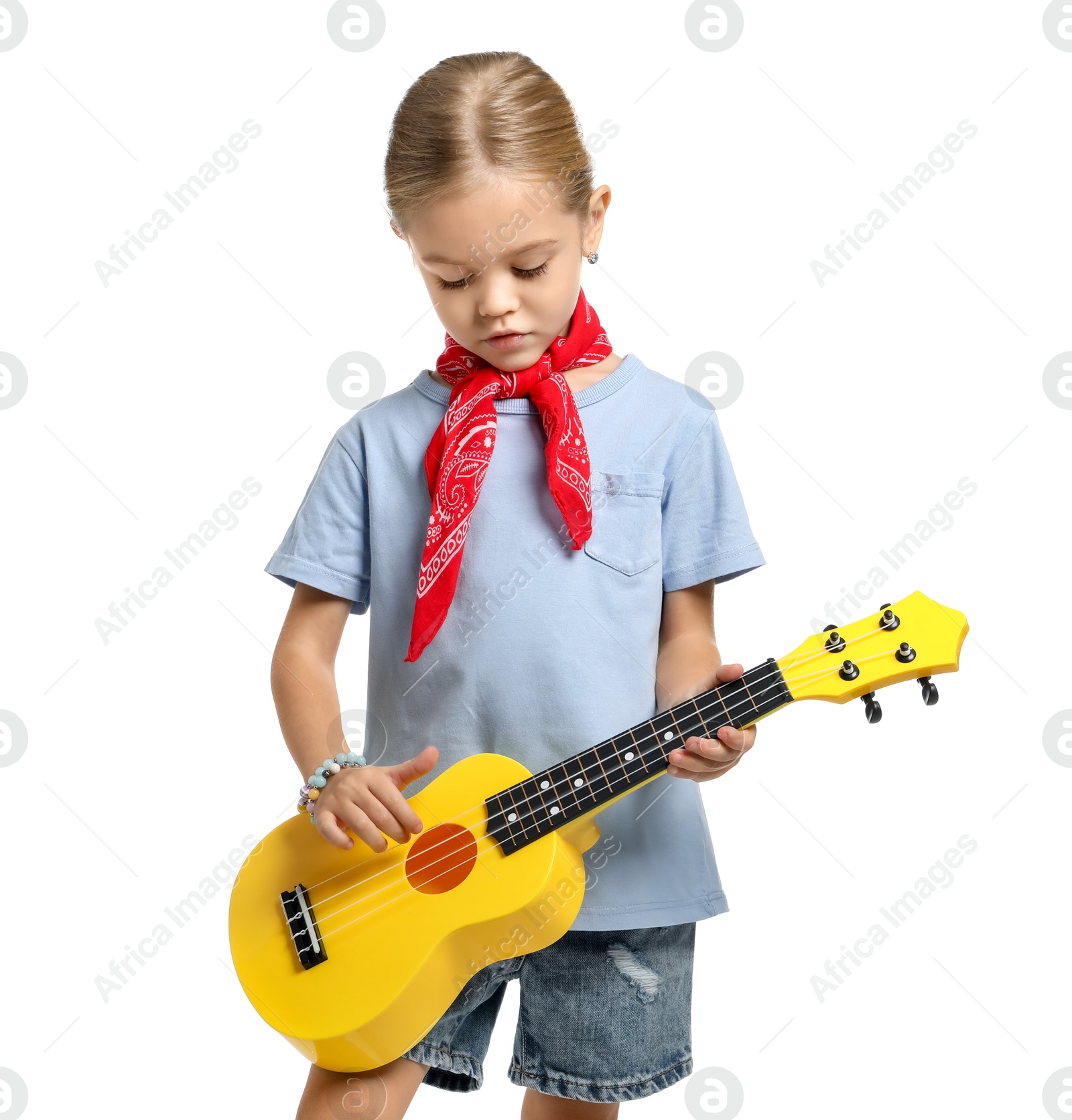 Photo of Little girl playing ukulele on white background