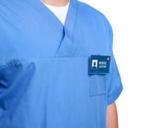 Photo of Medical assistant with badge on white background, closeup