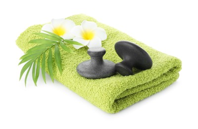 Photo of Spa stones, towel, green leaf and plumeria flowers isolated on white