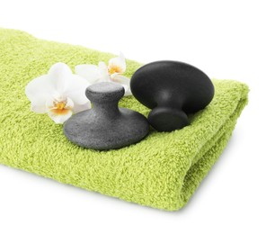 Spa stones, towel and orchid flowers isolated on white