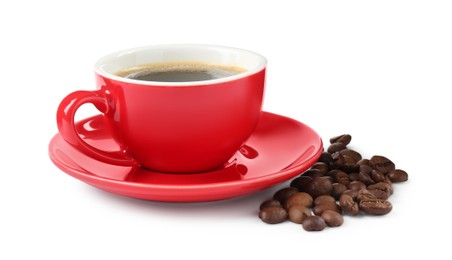 Photo of Red cup of aromatic coffee, saucer and beans isolated on white