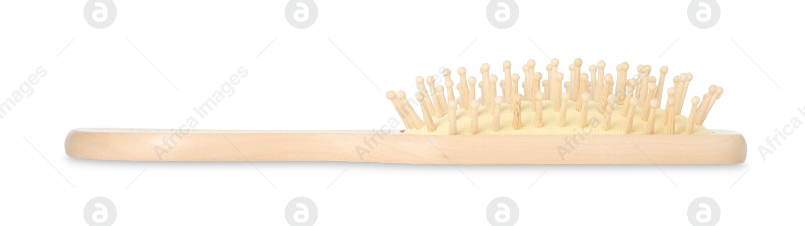 Photo of New wooden hair brush isolated on white