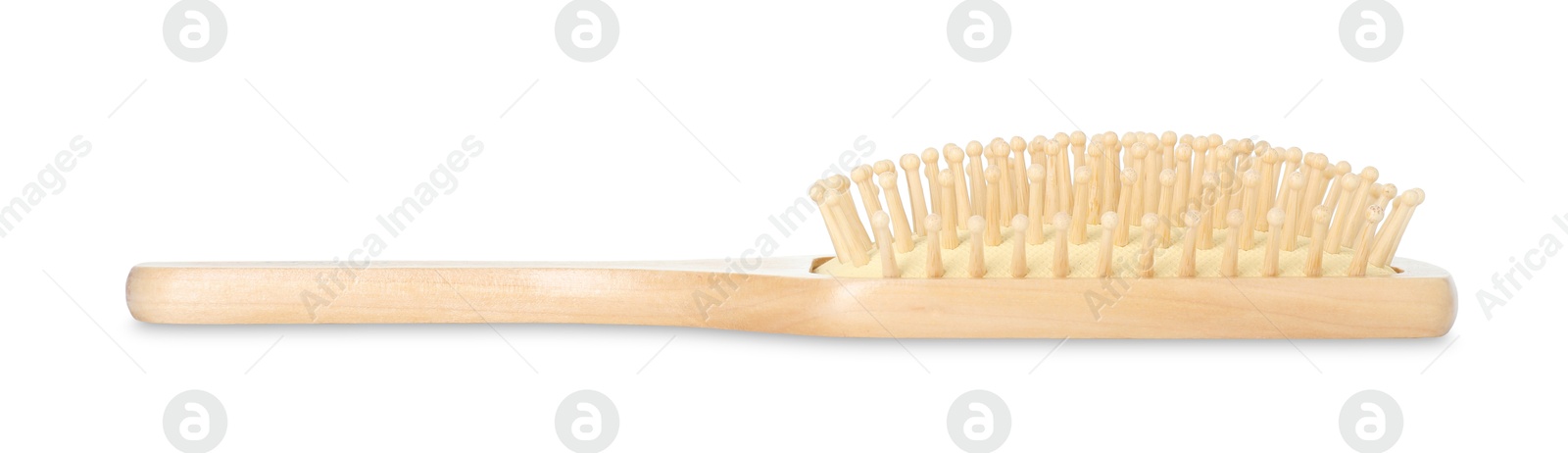 Photo of New wooden hair brush isolated on white