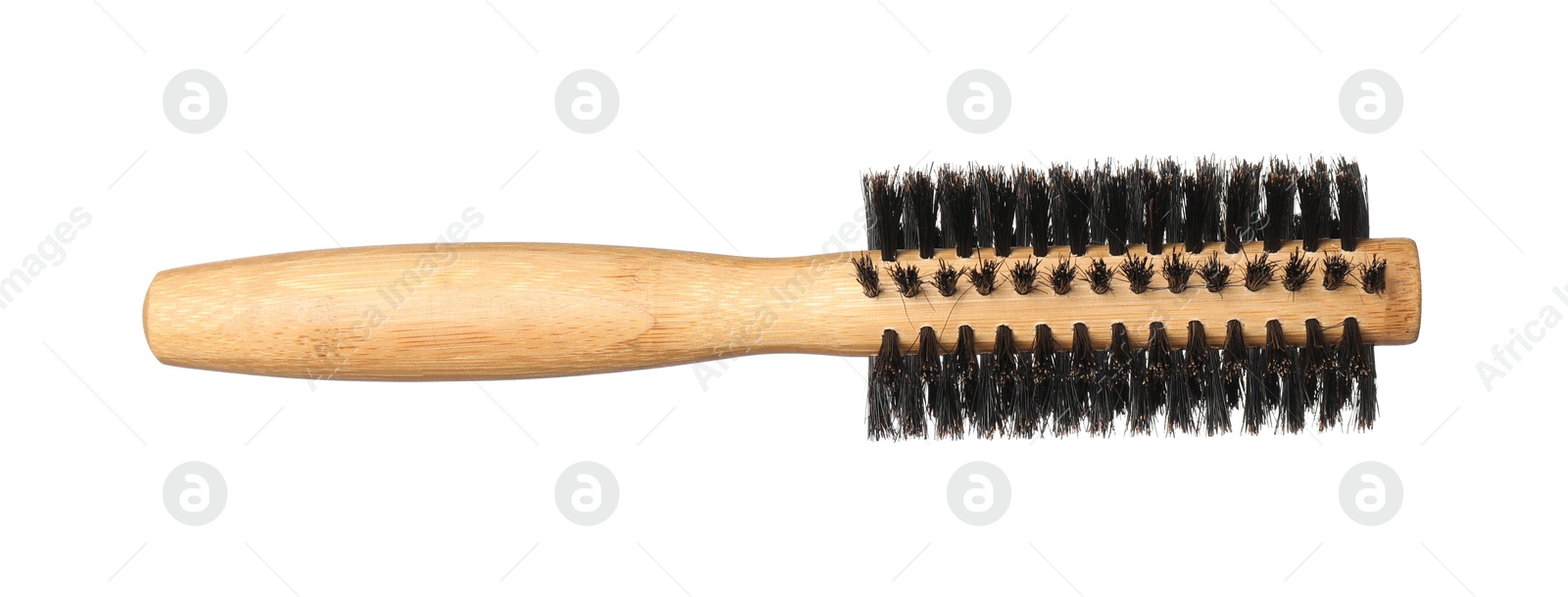 Photo of Hairdresser tool. Round wooden brush isolated on white