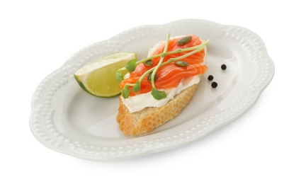 Photo of Delicious bruschetta with cream cheese, salmon and piece of lime isolated on white