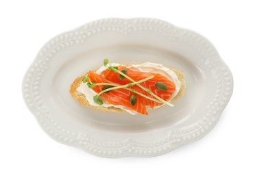 Photo of Delicious bruschetta with cream cheese and salmon isolated on white, top view