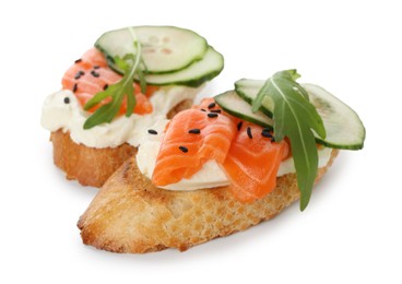 Photo of Delicious bruschette with cream cheese, salmon and cucumber isolated on white